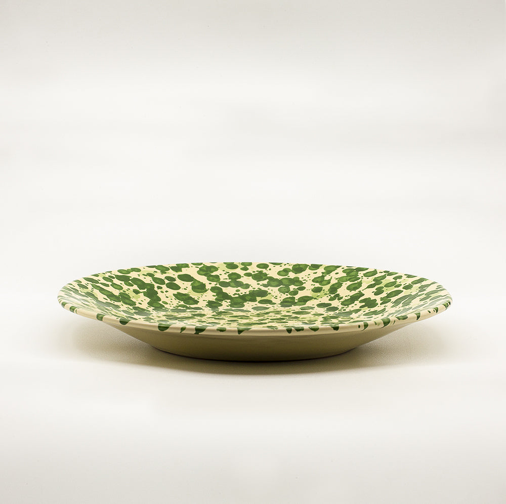 Ceramic dinner plate with irregular circumference. Handmade & hand painted spots a typical tuscan decoration.