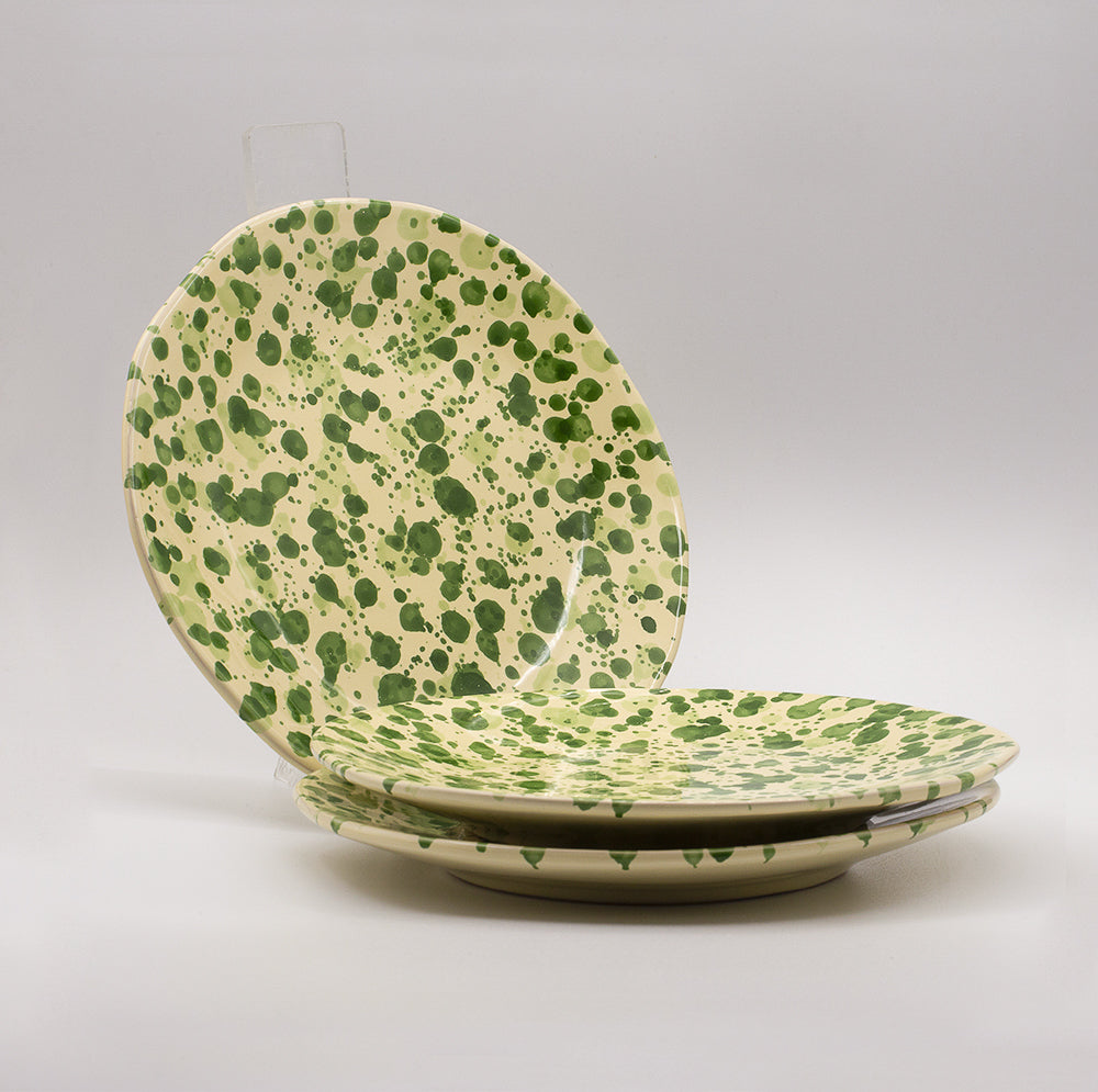 Ceramic dinner plate with irregular circumference. Handmade & hand painted spots a typical tuscan decoration.